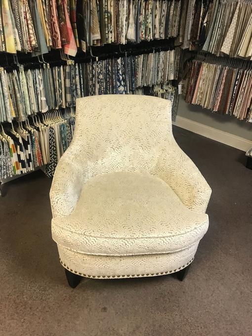 Custom furniture reupholstery Jacksonville FL, cream barrel chair nailhead trim