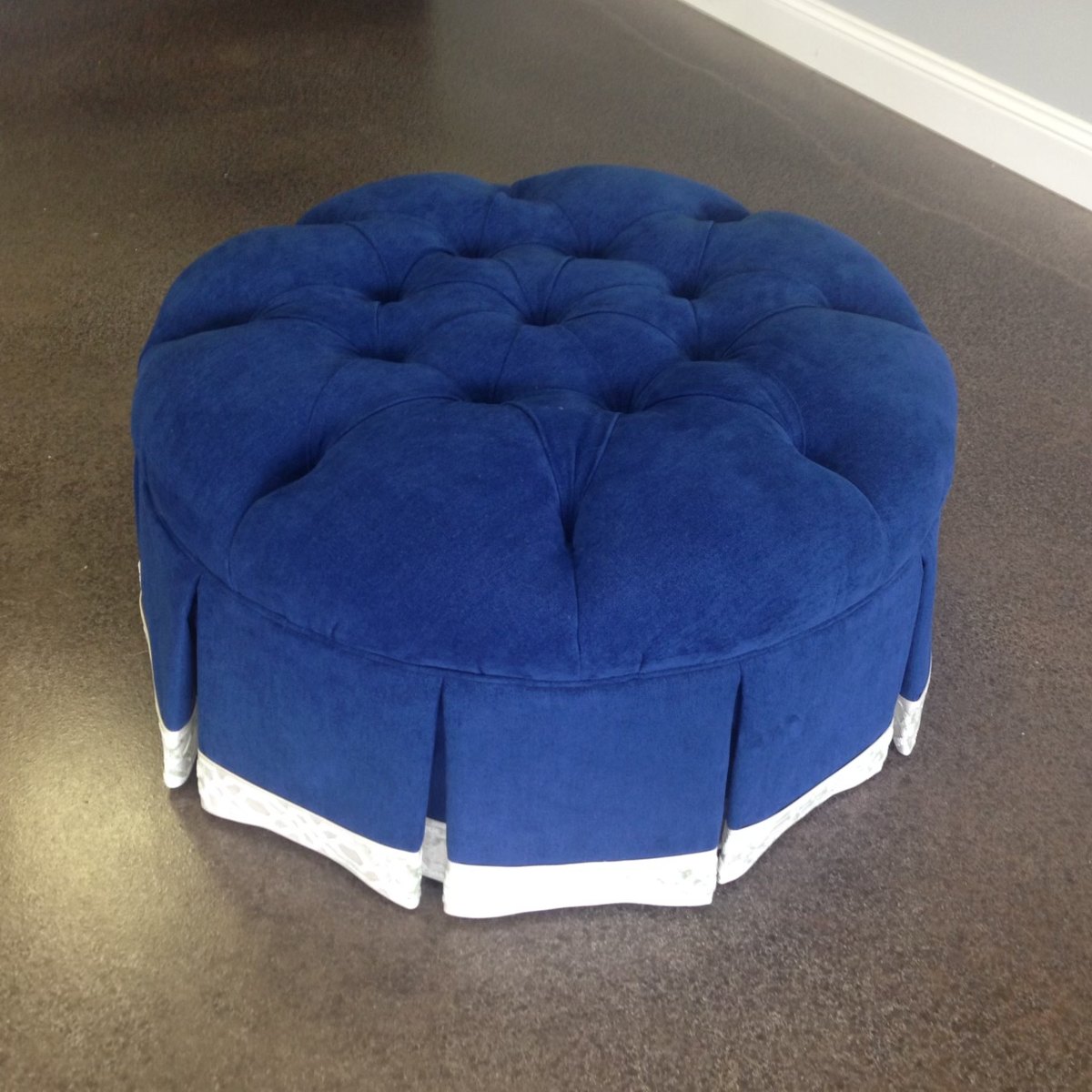 Custom tufted round ottoman blue velvet by Elvis Upholstery and Draperies, serving Ponte Vedra FL