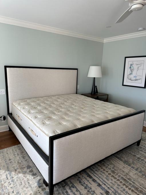 Custom upholstered bed frame headboard installed luxury bedroom Jacksonville FL