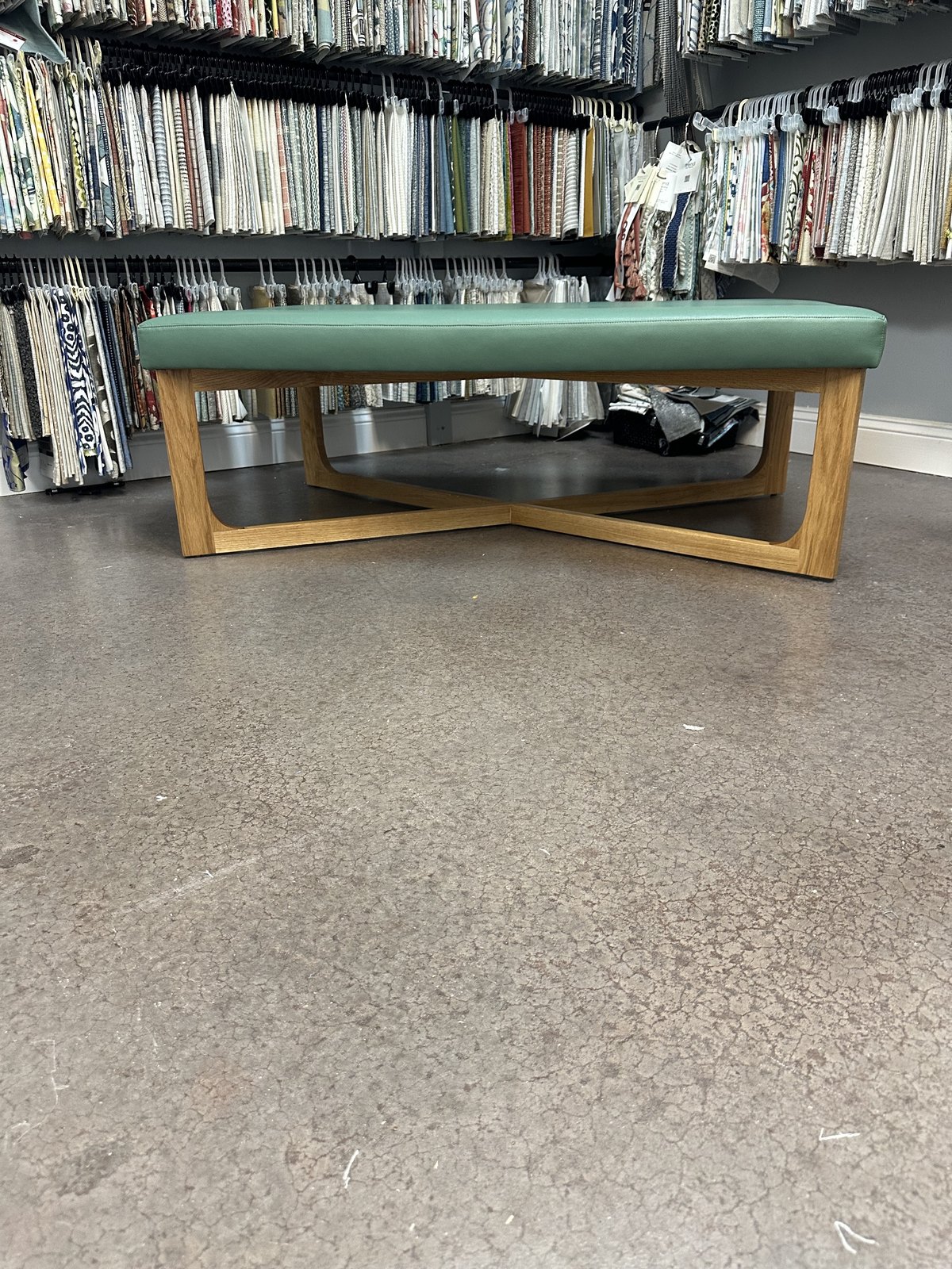 Custom teal upholstered bench on a wood base, Jacksonville FL