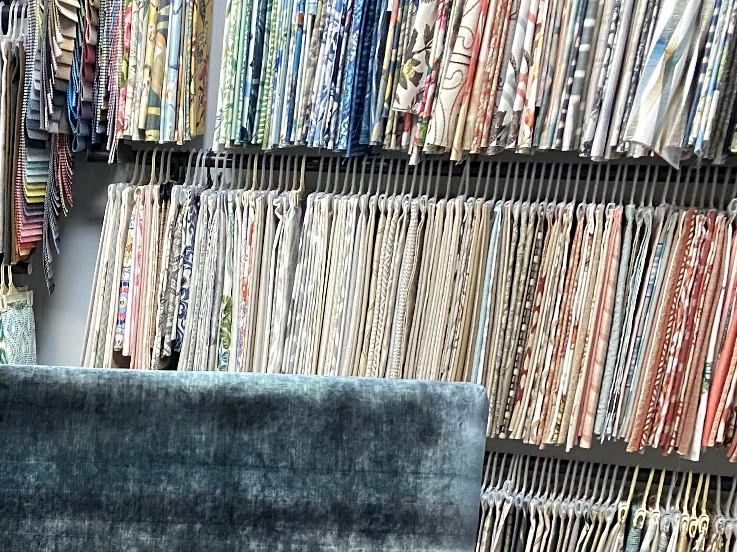 Fabric sample books wall by Elvis Upholstery and Draperies, serving Atlantic Beach FL