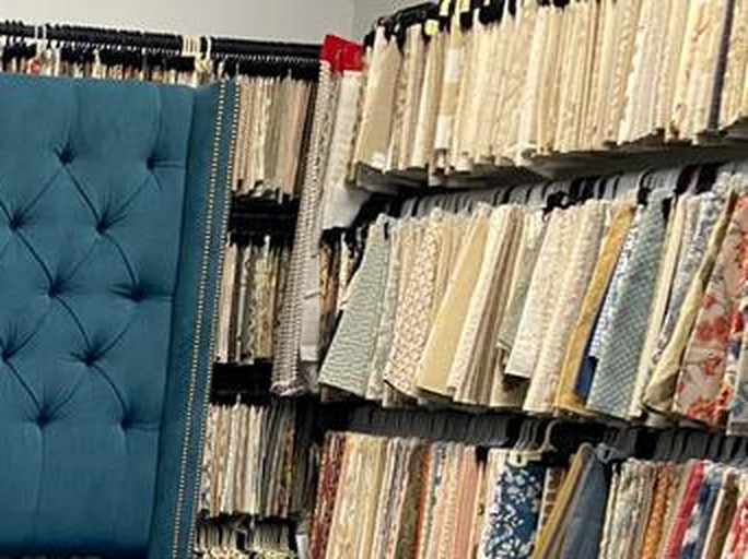 Wall of upholstery and drapery fabric swatch books at the Elvis Upholstery fabric store, Atlantic Beach FL
